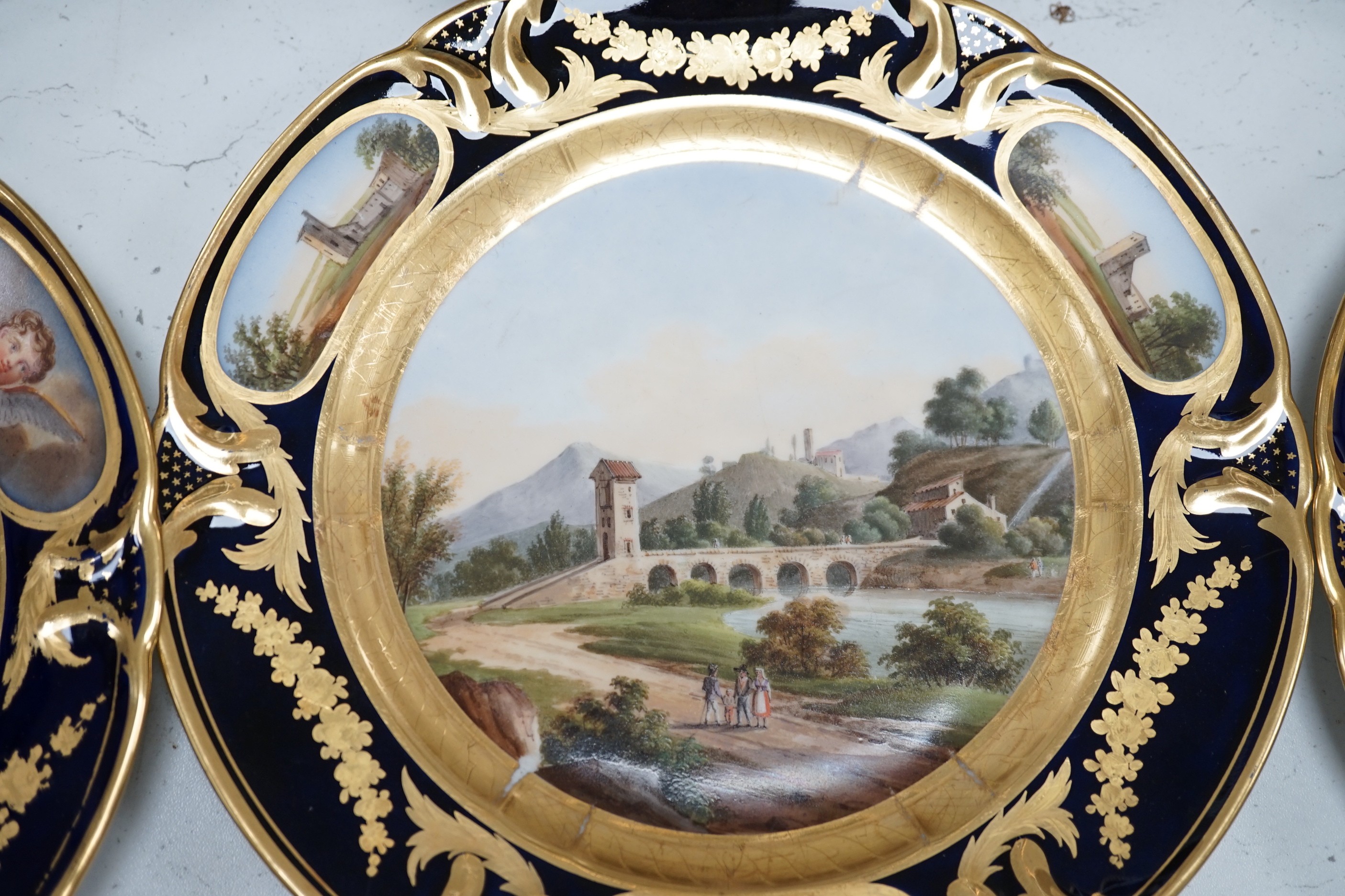 A group of 19th century Paris porcelain painted cabinet plates together with an associated footed bowl (group), plates 24cms diameter